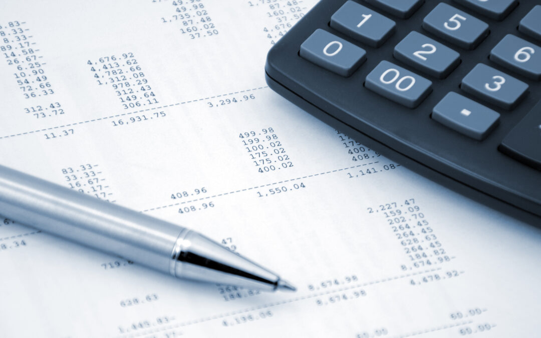Clean-up accounting financial statements, pen and calculator